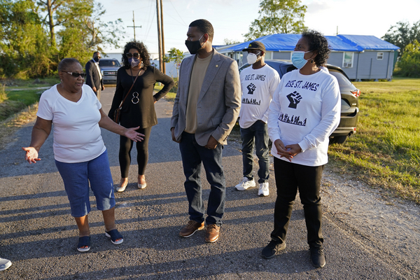 EPA Administrator Michael Regan, center, talks with environmental justice advocates in St. James Parish, La., in 2021. 