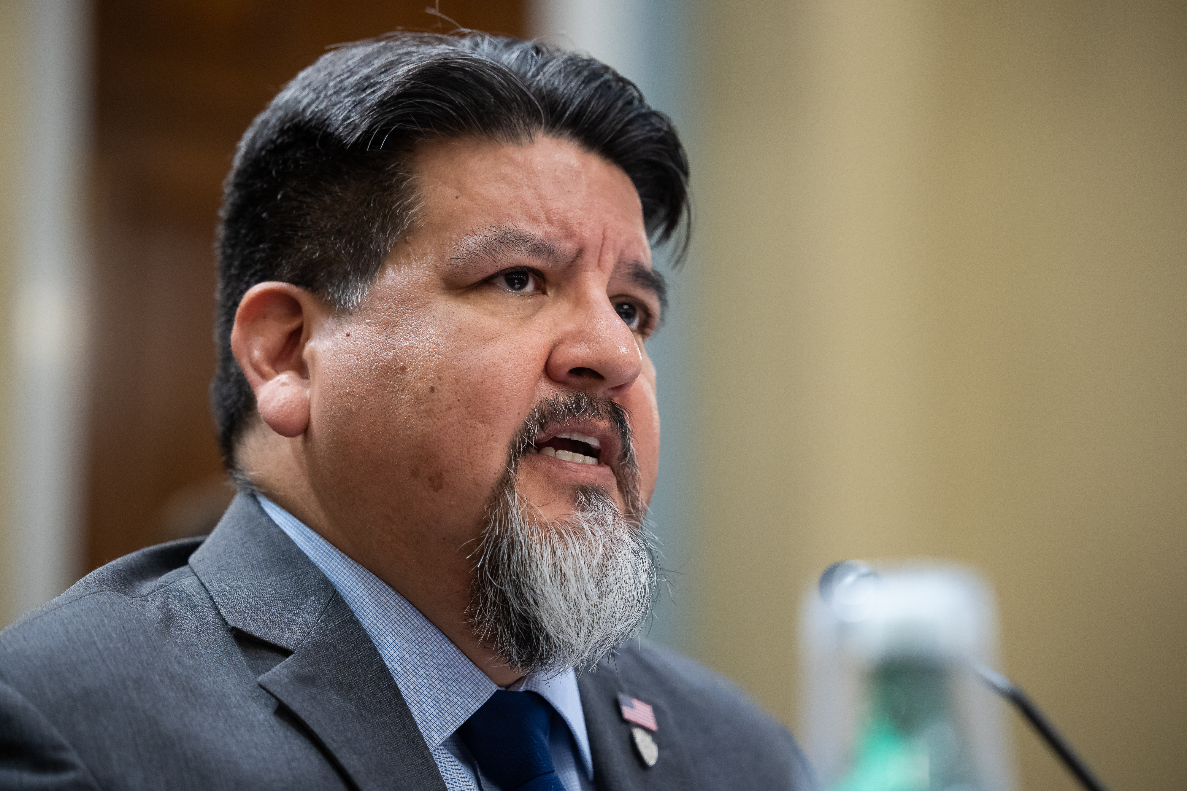 A close up of the face of National Park Service Director Chuck Sams.