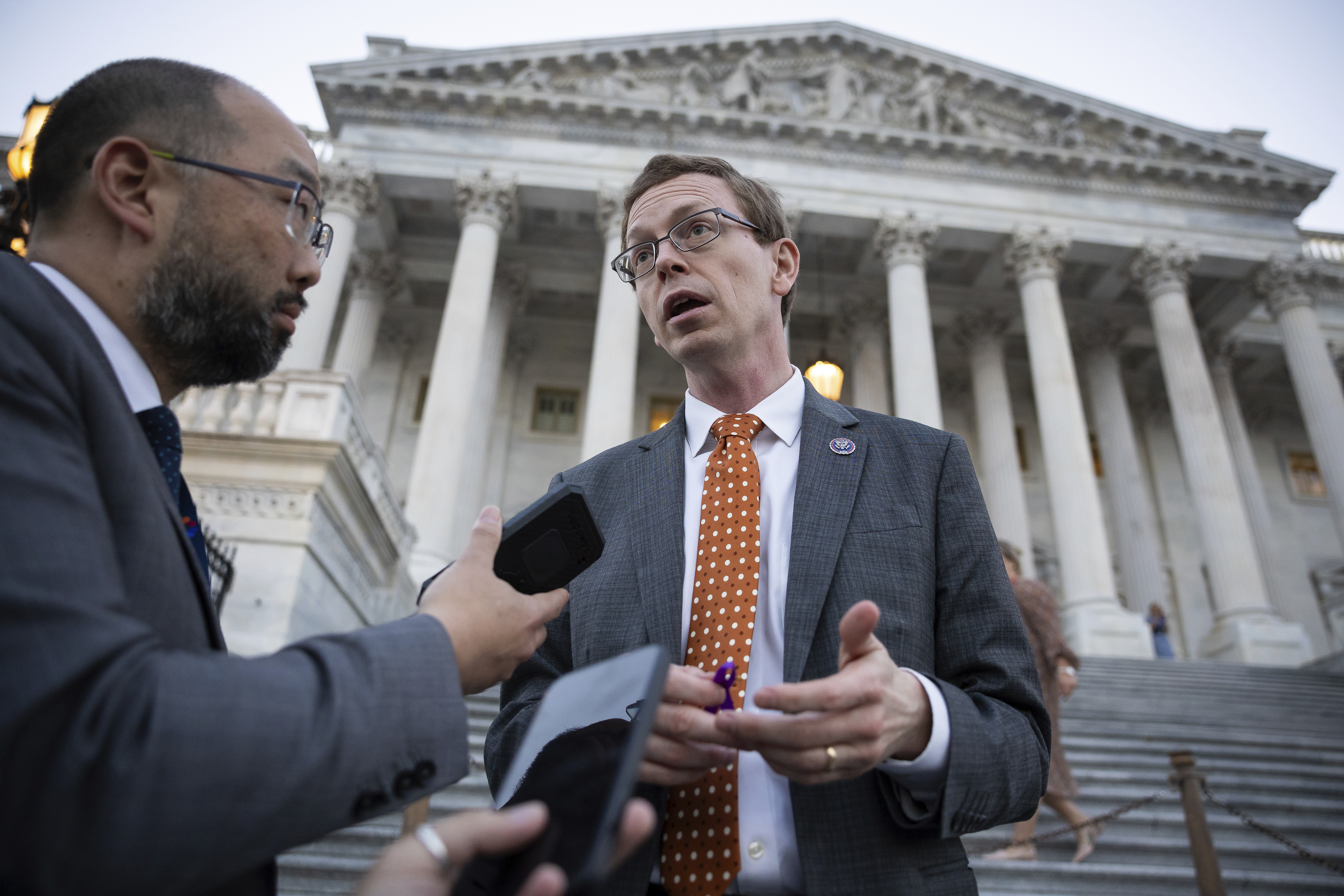 Dusty Johnson speaks with a reporter outside the U.S. Capitol. 