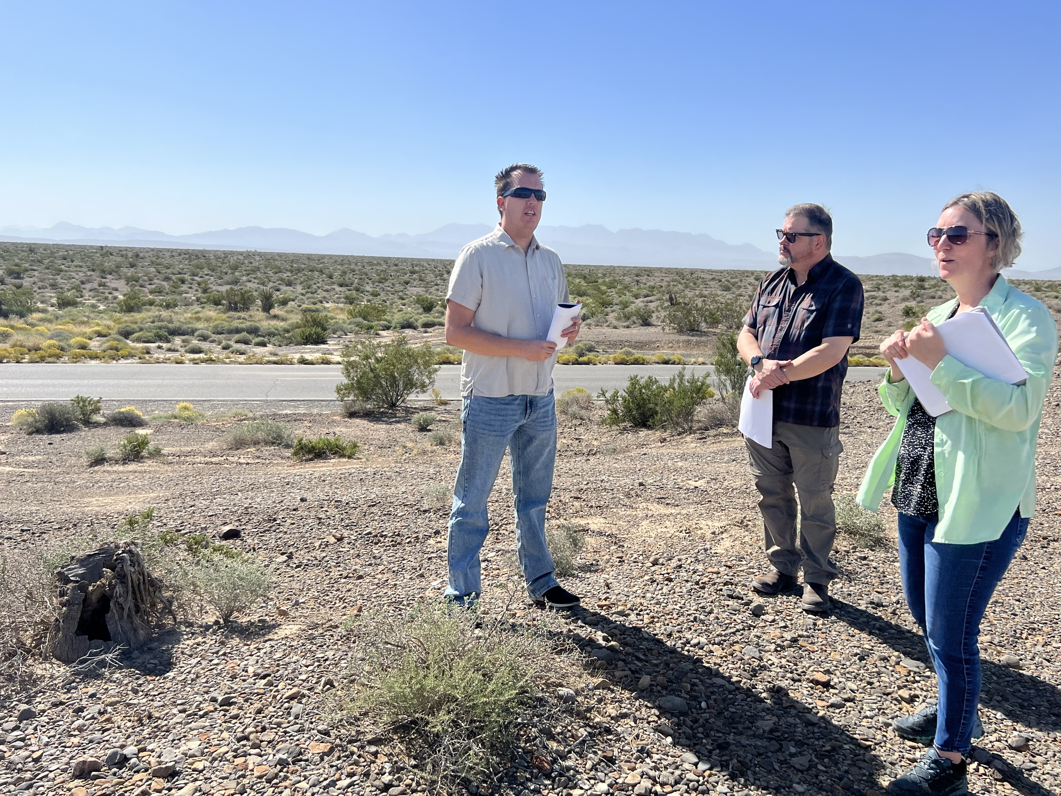 Nicholas Pay, manager of the Bureau of Land Management's Pahrump Field office, pictured left, and Beth Ransel, a BLM supervisory project manager, far right, at the site of the Golden Currant Solar Project.
