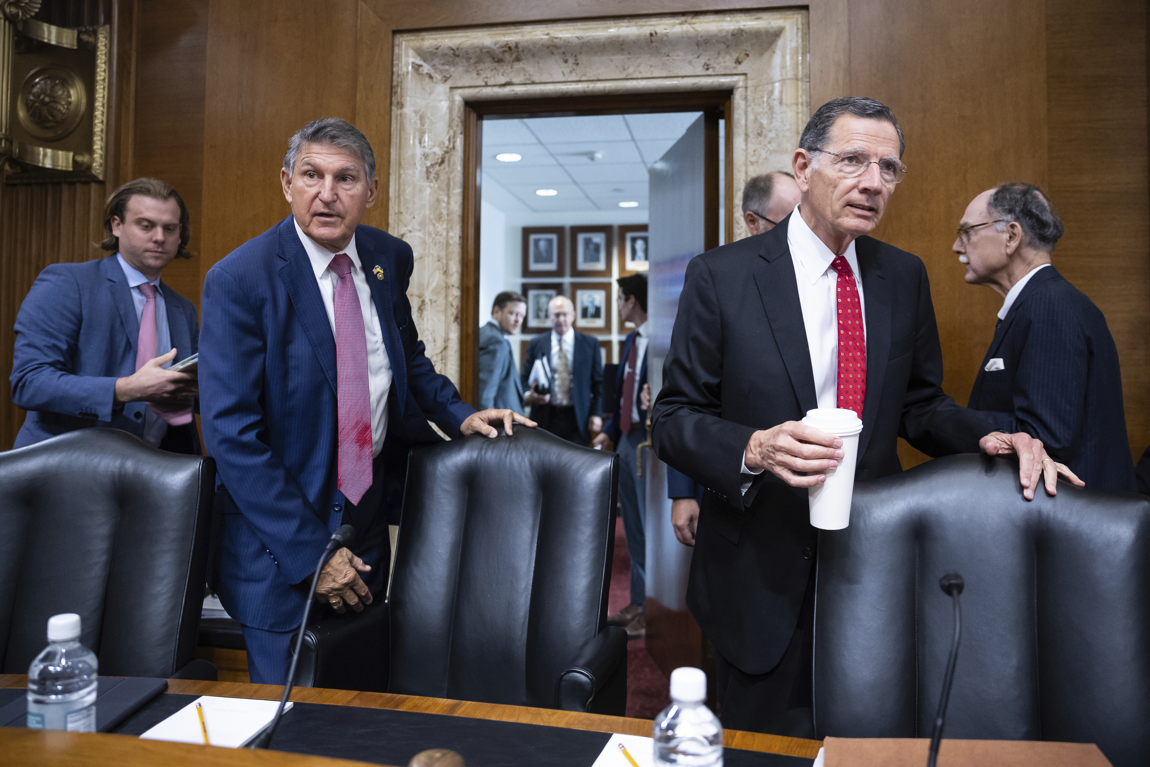 Sens. Joe Manchin (D-W.Va.) and John Barrasso (R-Wyo.).